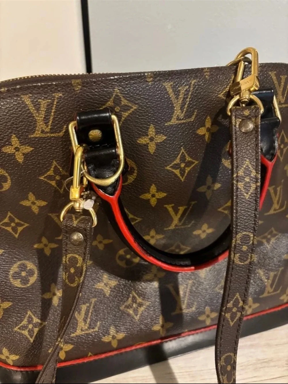 Louis Vuitton Monogram Alma Satchel in Brown with Red Trim